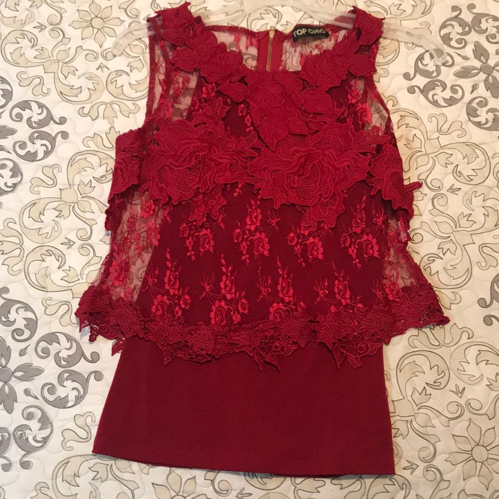 Red top with tang top bottom part with zipper.